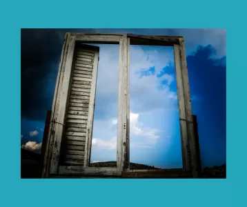 Old window against blue sky