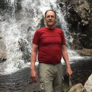 Lea hiking to a waterfall